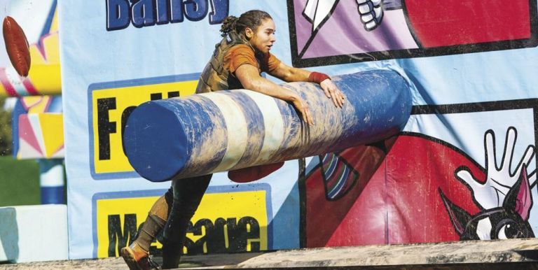 Brenna Crump climbs obstacle course
