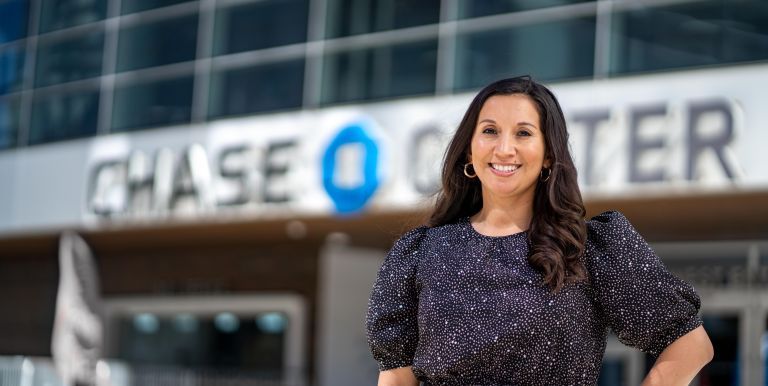 Nicole Barbour stands in front of Chase Center