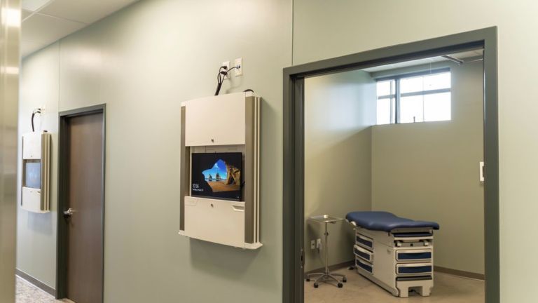 Image shows a hallway and the inside of an exam room at the CPAE.