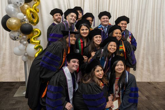 A group of graduates wearing regalia