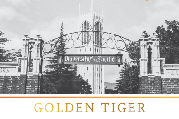 Black and white image of the Smith Gates with Burns Tower in the background.