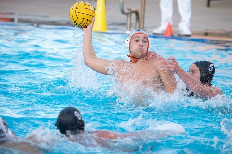 a Pacific water polo player prepares to throw the ball