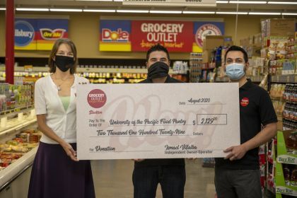 Jessica Bilecki of Pacific's food pantry with Ismael Villalba and Jesus Valenzuela, co-owners of the Grocery Outlet on North Wilson Way in Stockton.