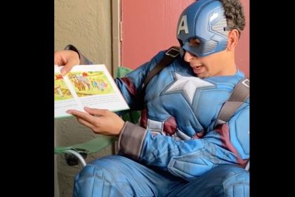 Ahmed Barnes ’22 as Captain America reading The Little Engine that Could.