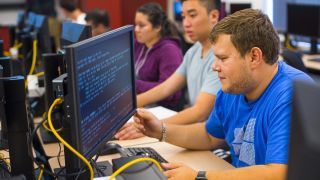 Students working on code.