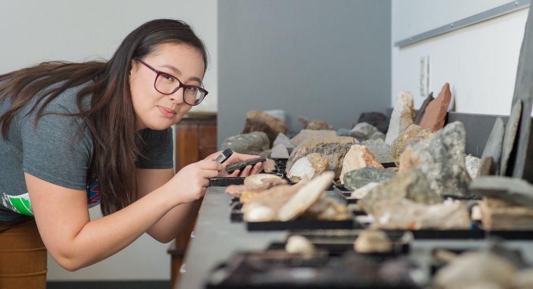 student studying rocks in classroom