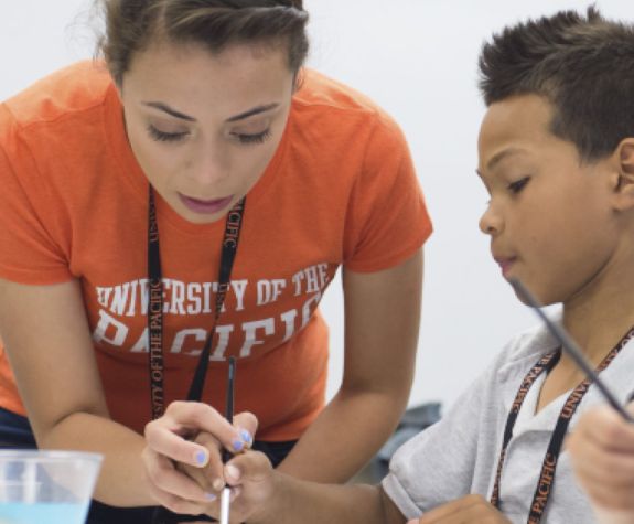 college of the Pacific student with child