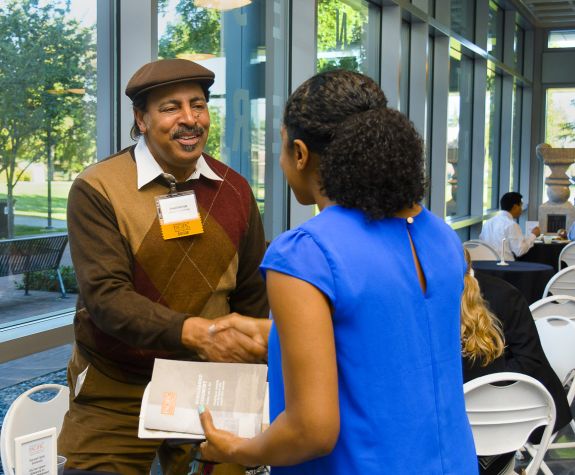 Donor shakes hand with student at the annual Pharmacy Scholarship Ceremony