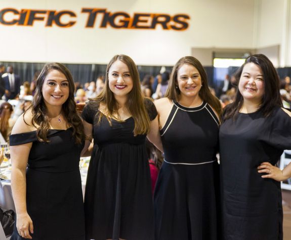 Four PharmD graduates at the annual Pharmacy Graduation Banquet