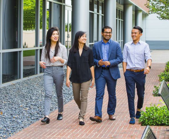 Sachin Shah walks with PharmD students on North Campus