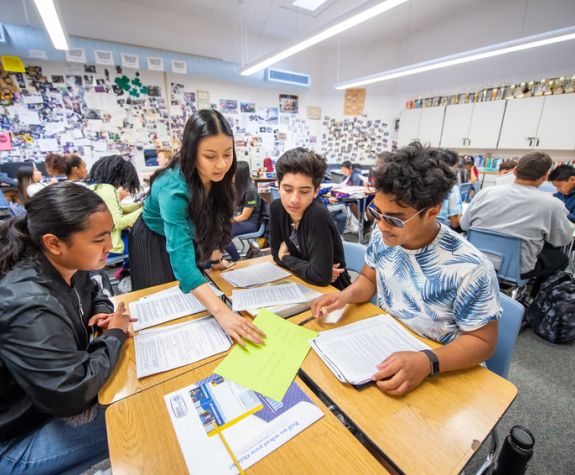 Alumna Ashley Pham with her students