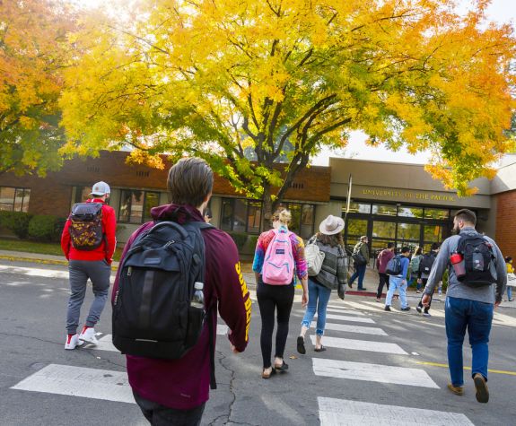 students walk to class on the Sacramento campus