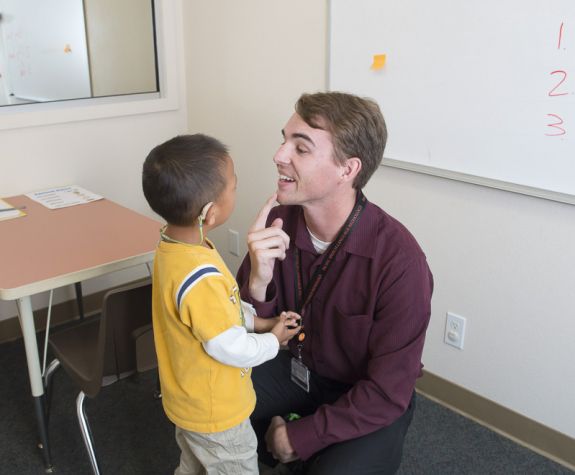 SLP student working with child