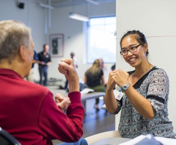 physical therapy student in clinic with patient