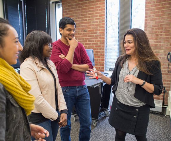 Economics professor Sharmila King and students