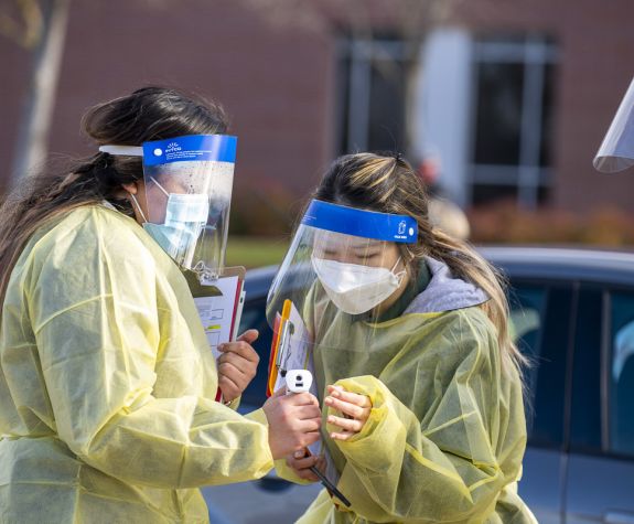 Vaccinations for the Covid-19 virus are given in the parking lot outside of the Chan Center