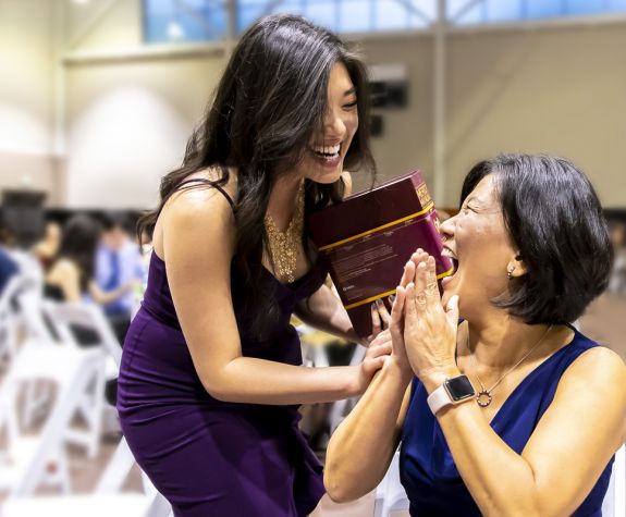 Graduate and faculty member at the Graduation Banquet