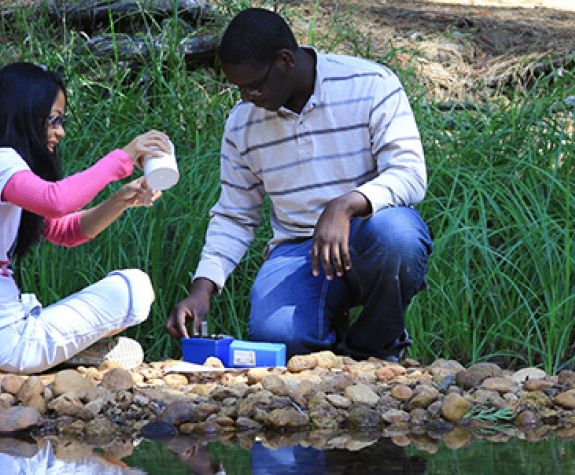 environmental science students conduct water test
