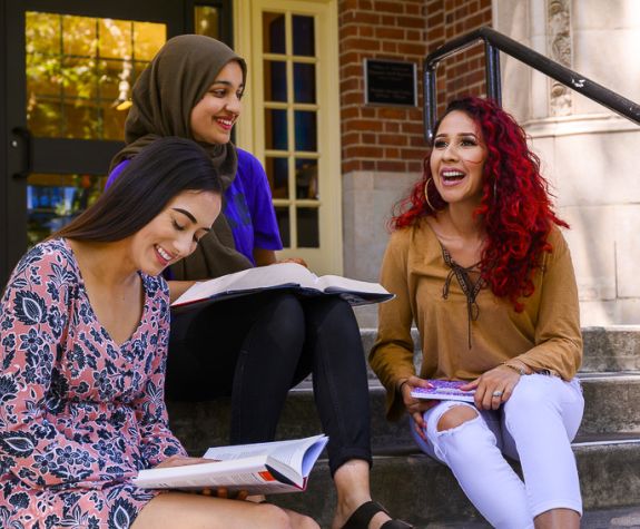 Sociology students Catalina Vasquez, left, with Brianna Rojas, right, and Rahila Shah
