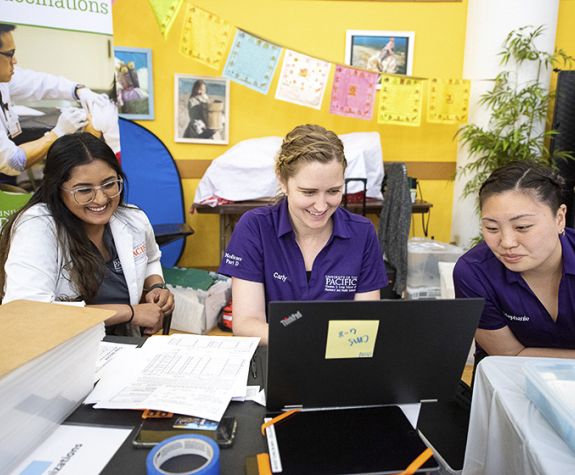 Carly Ranson with PharmD students at a Medicare Part D Outreach Clinic