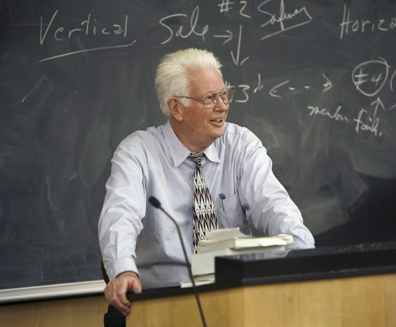 Claude Rohwer behind a lectern