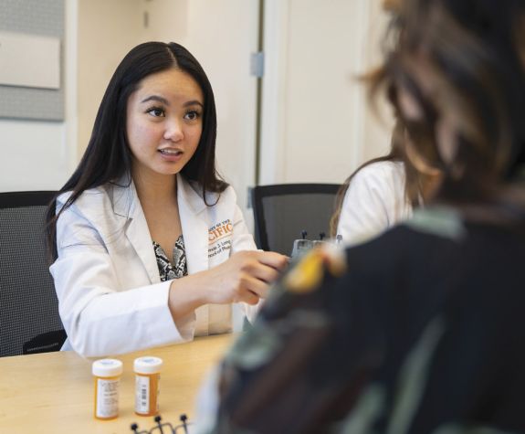 Student in the Doctor of Pharmacy (PharmD) program works with community members in a clinic on University of the Pacific's Stockton campus.