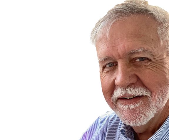 A man smiles for a photo 