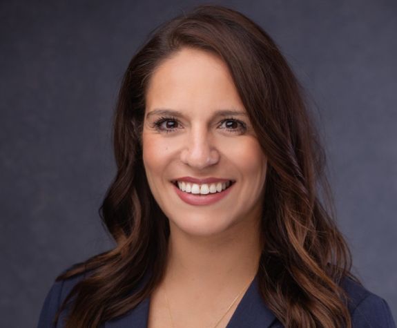 A portrait of a woman in a suit 