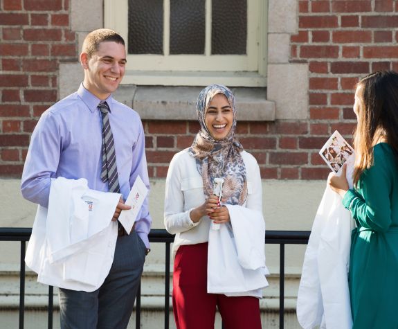 Three PharmD students at White Coat Ceremony
