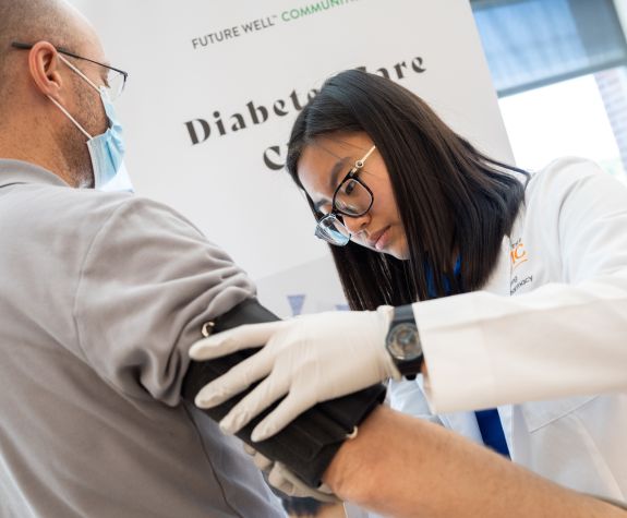 PharmD student with patient