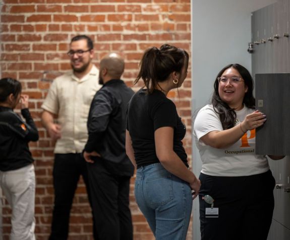 students talking in a hallway