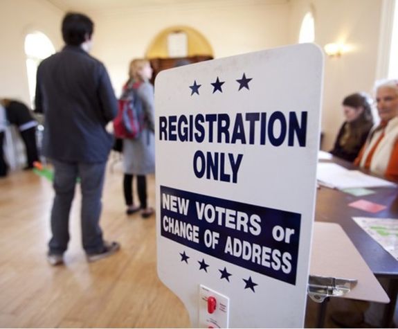 a sign saying "registration only, new voters or change of address"
