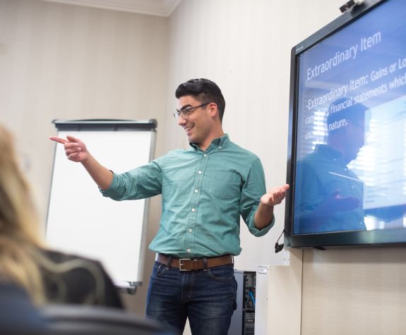 Man presenting to a business class