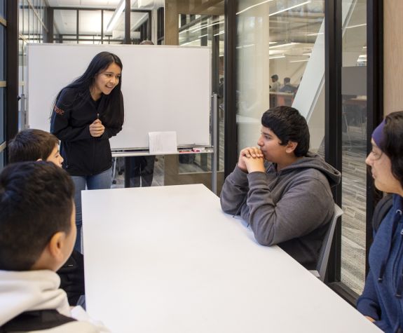 Pacific student leading group discussion