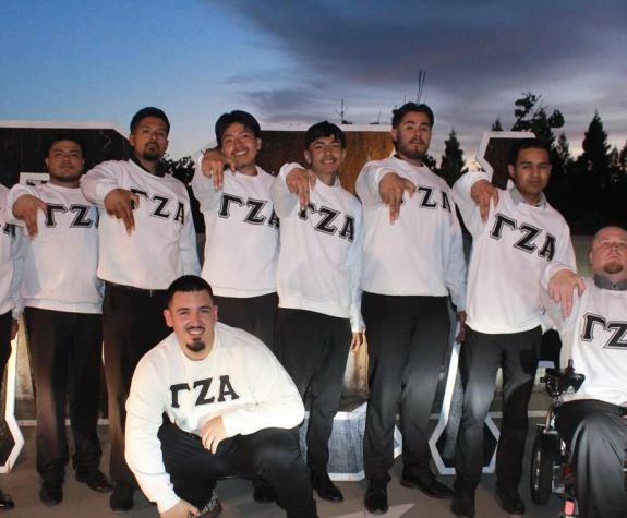 men in a group wear white shirts 