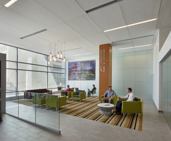 people talk and study in a lounge at Dugoni
