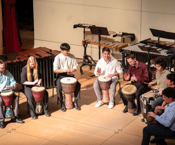 Students from Pacific Percussion Ensemble with Director Jonathan Latta