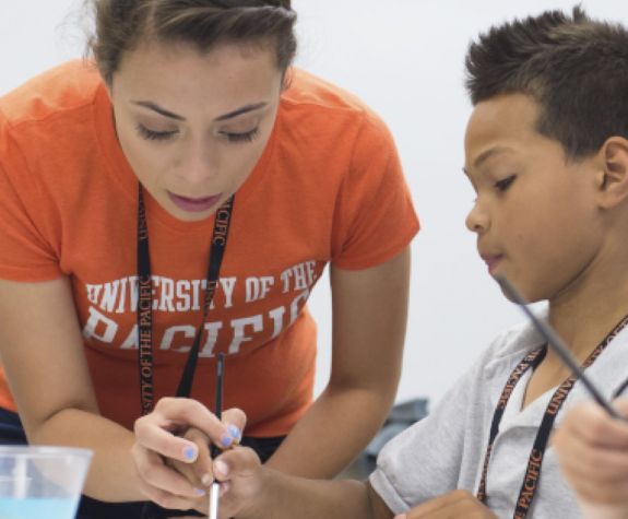 college of the Pacific student with child