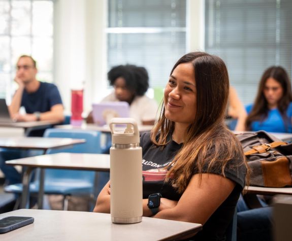 students look toward the front of the classroom