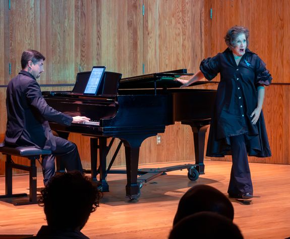 Pianist Eric Dudley and soprano Heidi Moss Erickson perform on stage