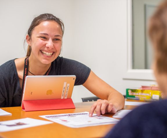 University of the Pacific graduate student works with child in school