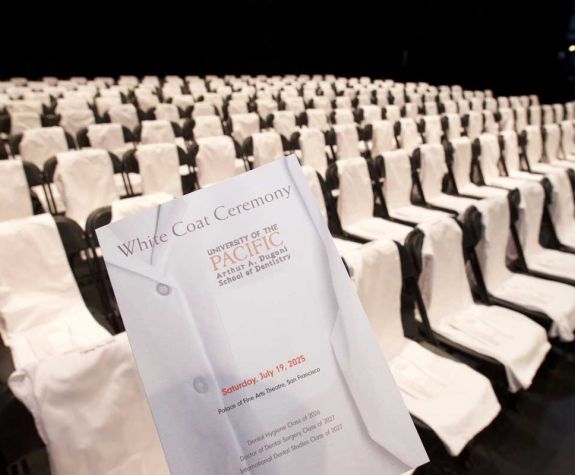 cover of White Coat Ceremony program with chairs in background