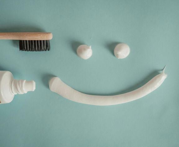 Photo by hello aesthe: https://www.pexels.com/photo/toothbrush-a-a-tube-of-toothpaste-and-a-smile-painted-with-toothpaste-15694640/