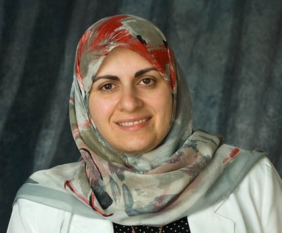 The photo shows the smiling face of Dr. Nassrine Noureddine.