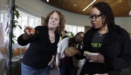 Doctoral students participating in class
