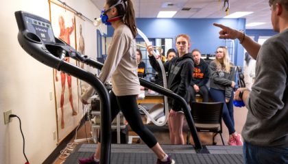 Female walking on treadmill.