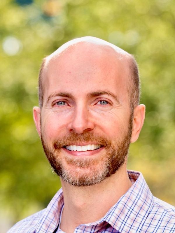 Photo shows the smiling face of Dr. Derek Isetti.