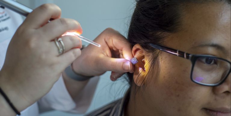 Audiology student with patient