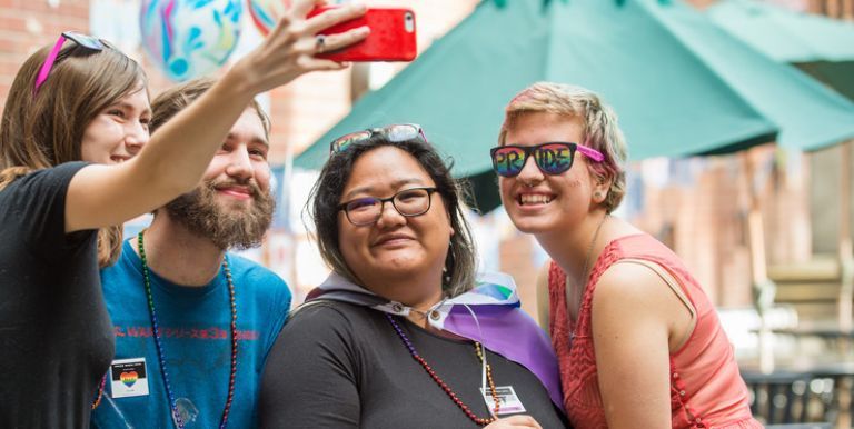 Students taking a selfie during Pacific's Pride celebration
