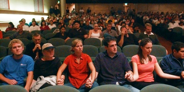 Pacific students holding hands